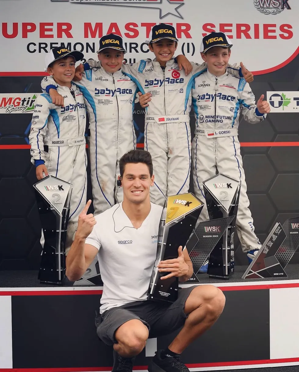Alessio Lorandi with BabyRace drivers at WSK Super Master Series podium in Cremona
