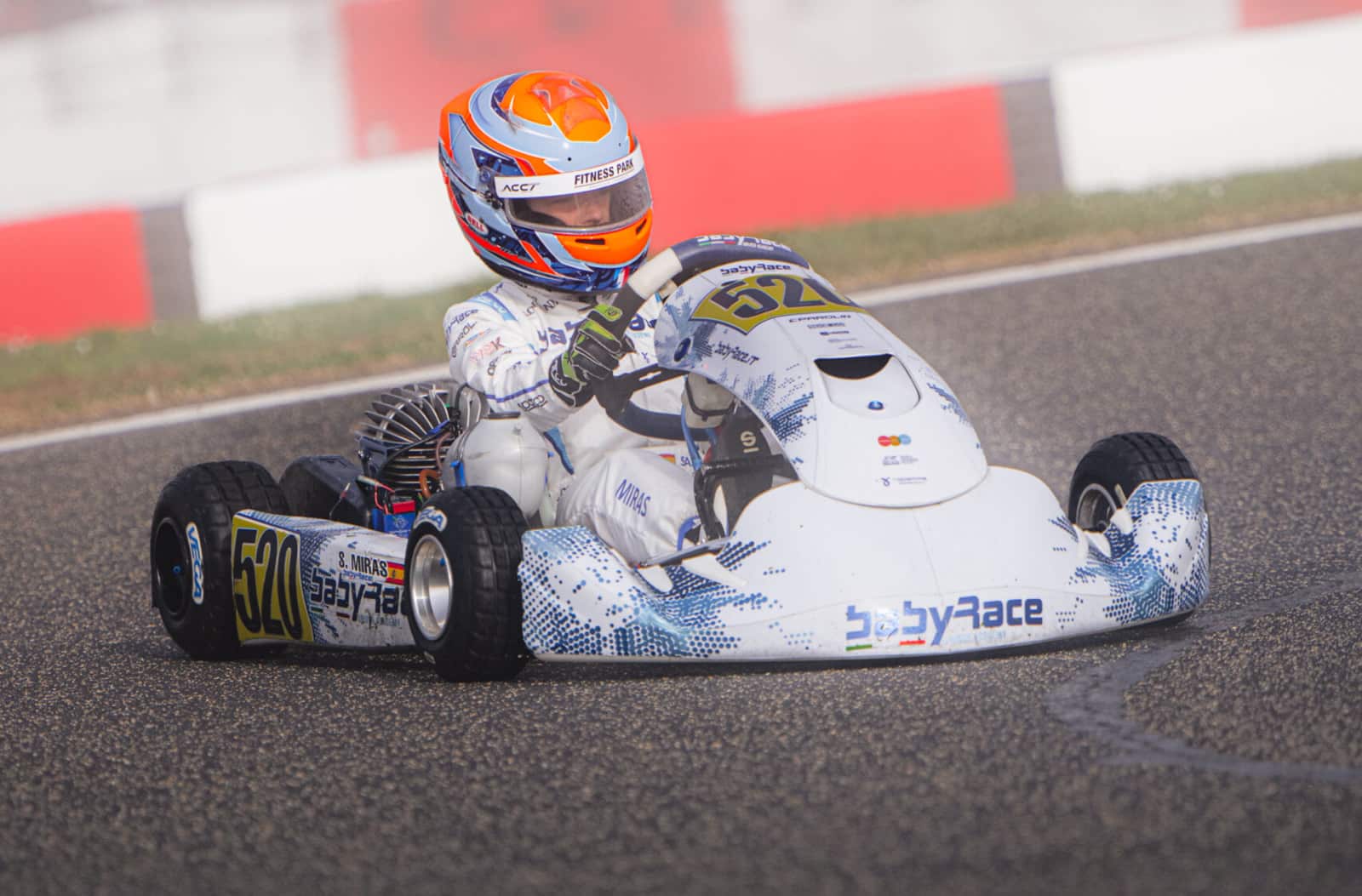 Babyrace kart alone on track warming its tires during an outlap