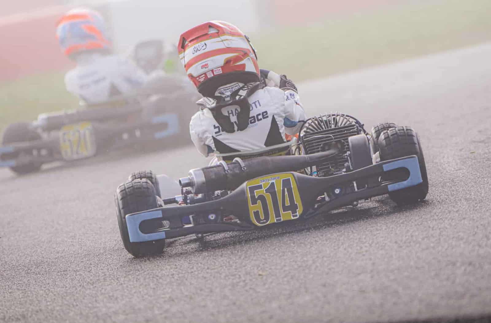Babyrace karts running in cold foggy conditions where tire compound matters most