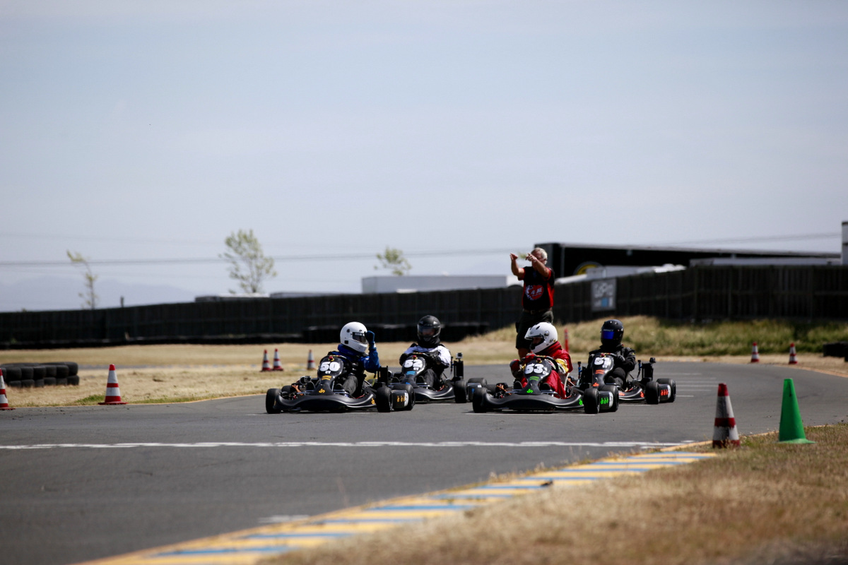 Karts lined up on the starting grid before a race