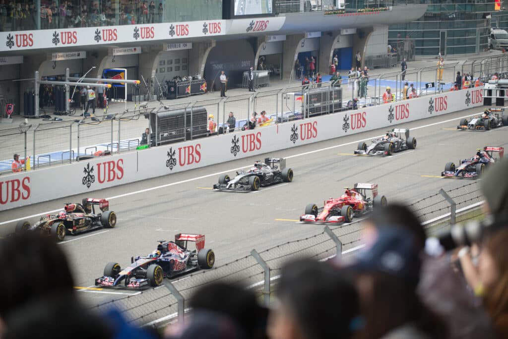 Formula 1 cars lined up on the grid for a standing start