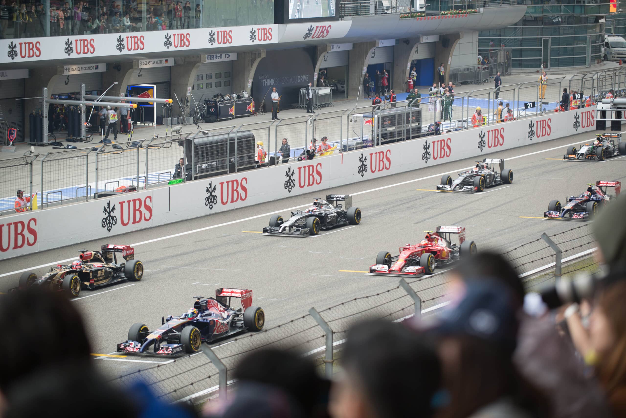Formula 1 cars lined up on the grid for a standing start