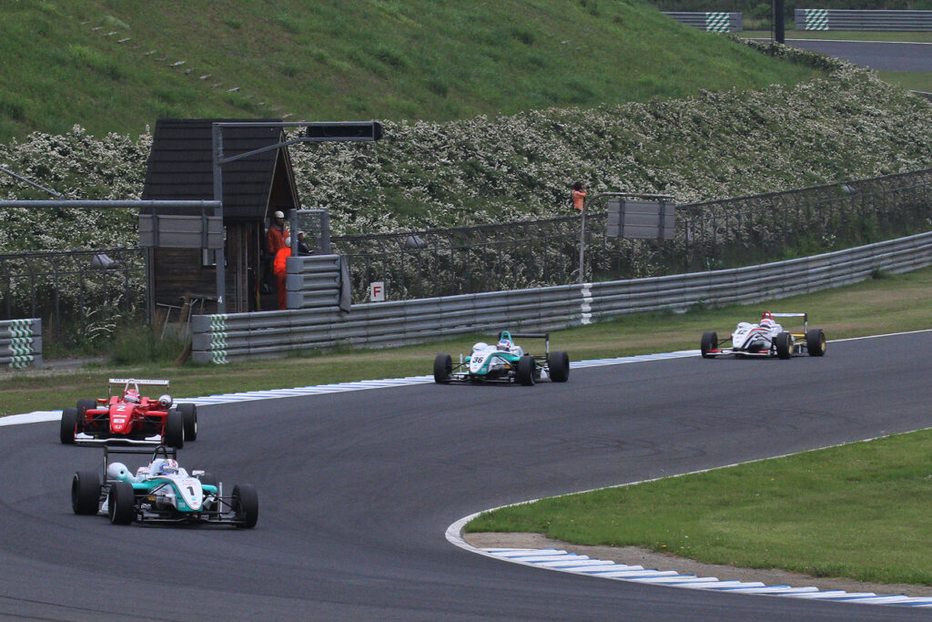 Formula 3 cars on a formation lap before the race start