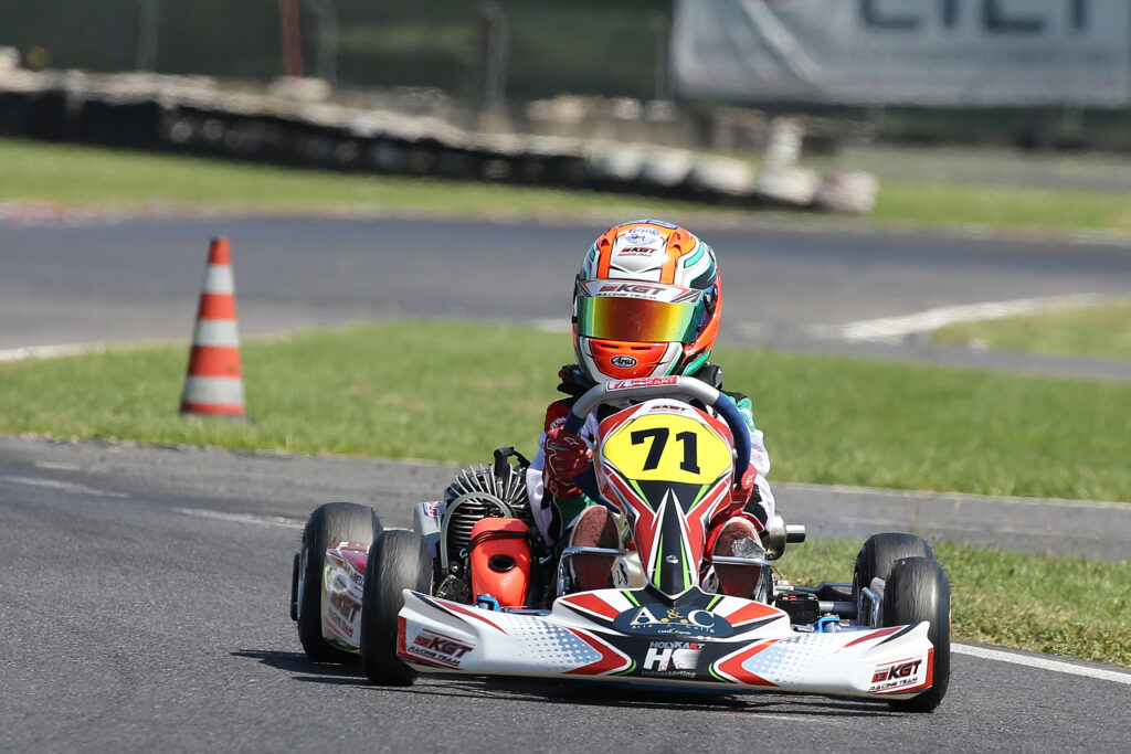 Kart riding the kerb next to a corner marker cone