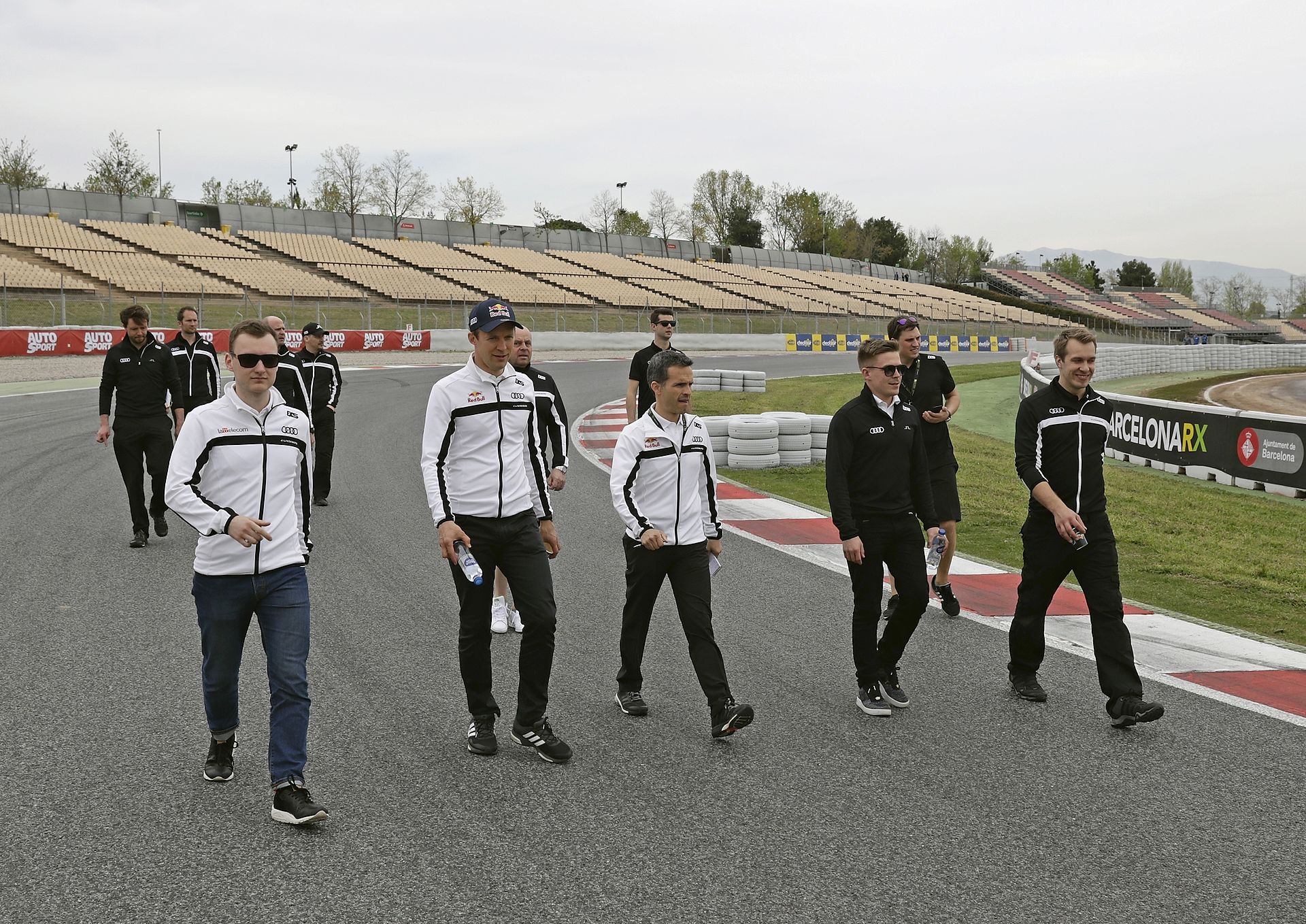 Drivers on foot walking a race circuit during a track walk