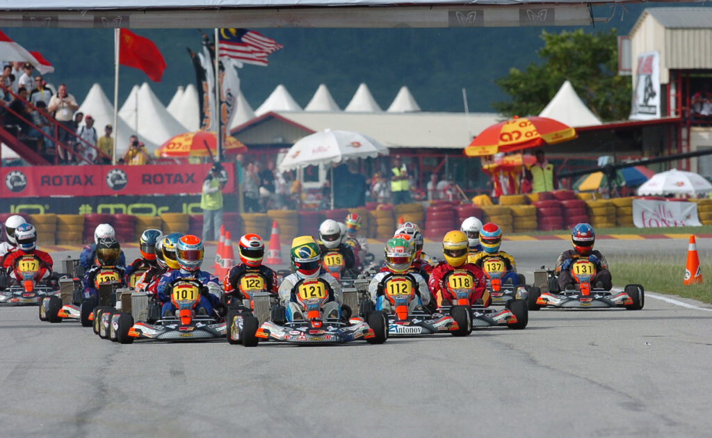 Full grid of race karts launching from a standing start at the Rotax Max Grand Finals