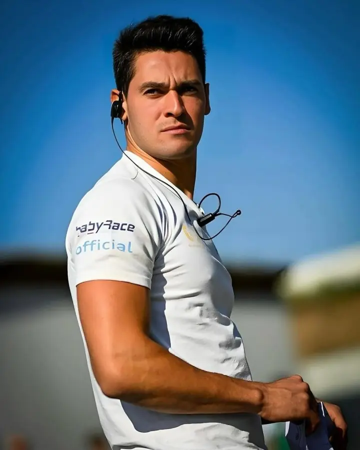 Alessio Lorandi trackside with a radio headset, coaching BabyRace drivers